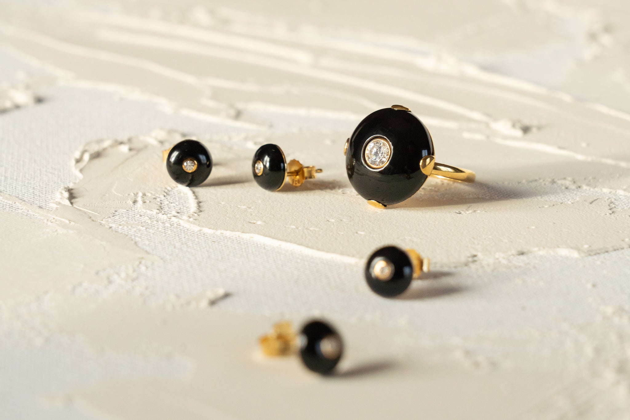 Mini Celt Studs Black in Gold